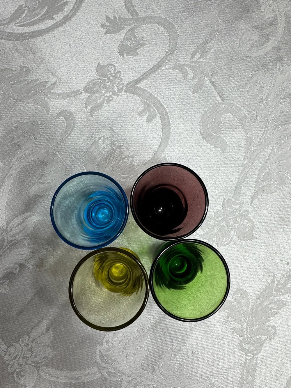 (4) MCM hand blown multi colored shot glasses.